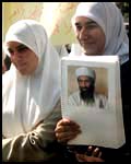 A student at An-Najah University in Nablus displays her 'official' Osama bin Laden notebook at a protest against the US yesterday.